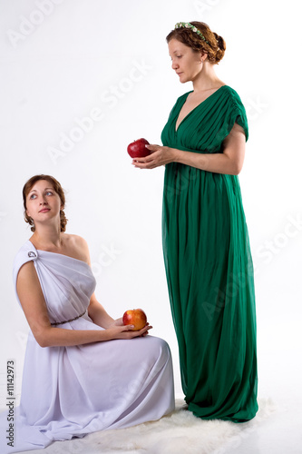 Two ladies and two apples photo