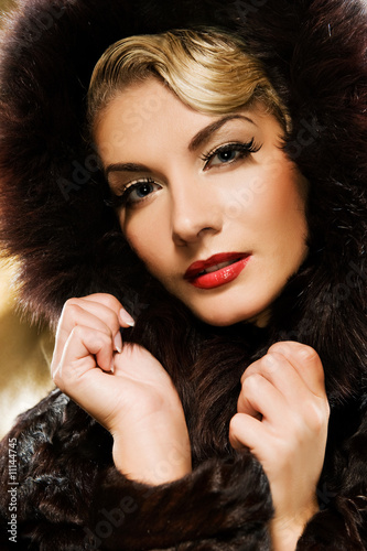 Beautiful woman in winter fur coat. Retro potrait