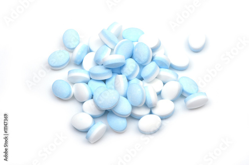 close up shot of blue and white pills