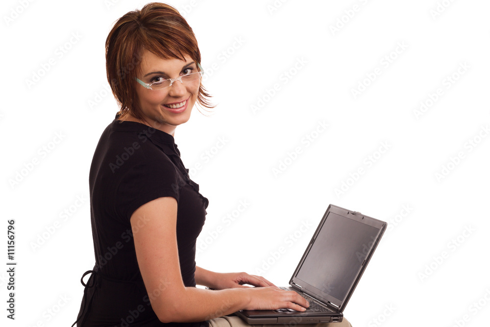 Friendly young Caucasian female working on laptop Friendly young Caucasian female working on laptop
