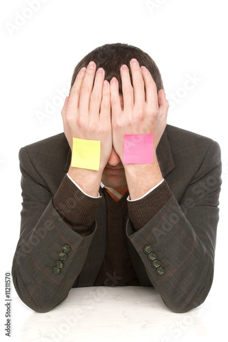 businessman hiding behind hands and stickers
