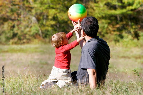father and son playing outdoors