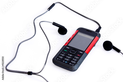 Photo of isolated on white music mobile phone with headphones