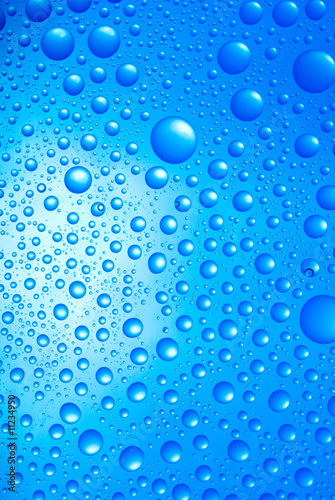 water drops over blue background