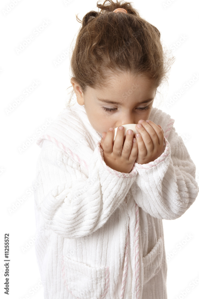 Little girl sniffing fragrant soap Little girl sniffing fragrant soap