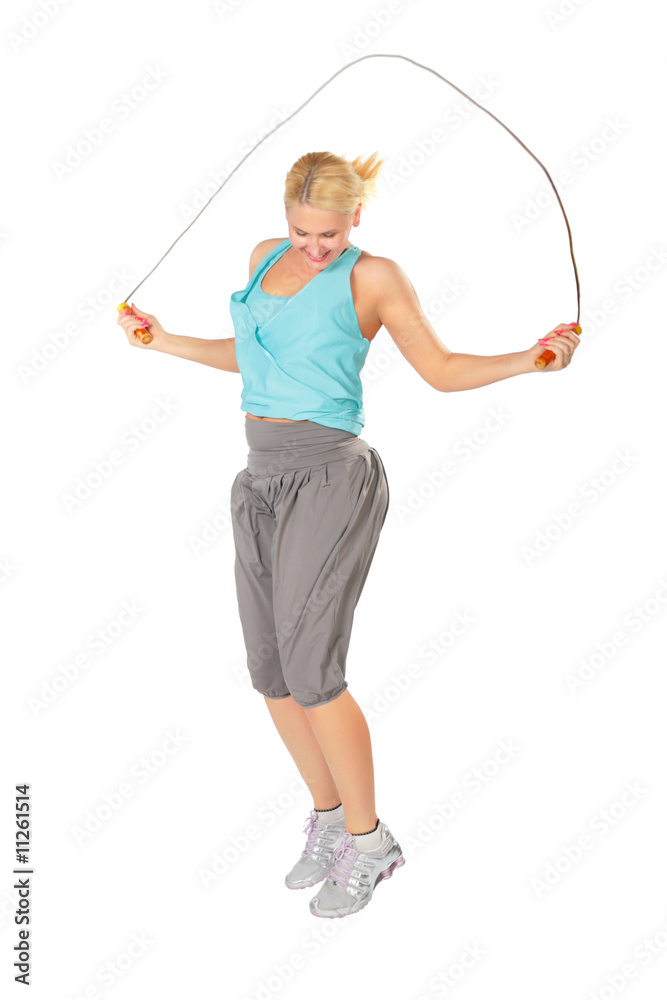 Woman jumps with a skipping rope Woman jumps with a skipping rope