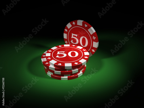 Poker chips close up over a green table
