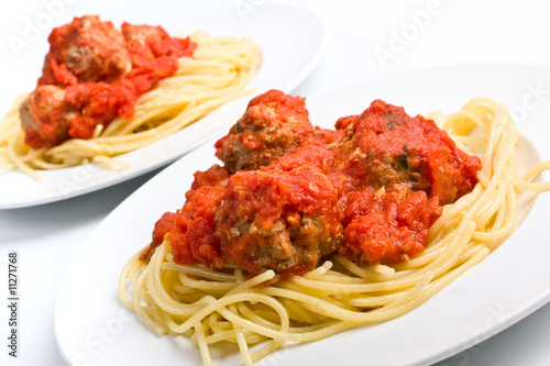 two servings on spaghetti with meatballs in tomato sauce
