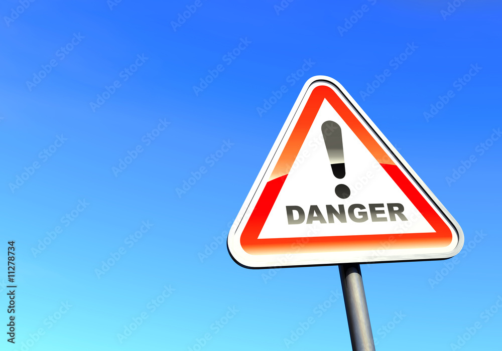 Danger - exclamation point sign against the blue sky Danger - exclamation point sign against the blue sky