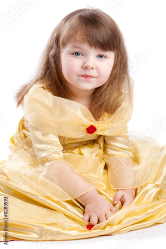 Cute girl in golden dress