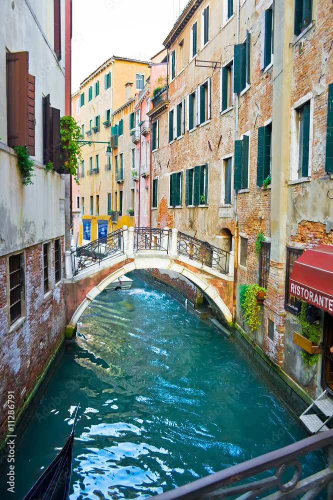 Canal in Venice and Restaurant