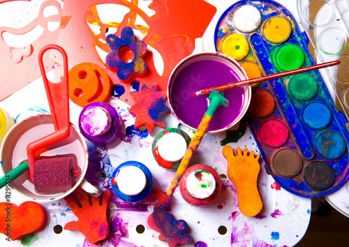 Creative Art Background made of old paint brushes, albums, palet