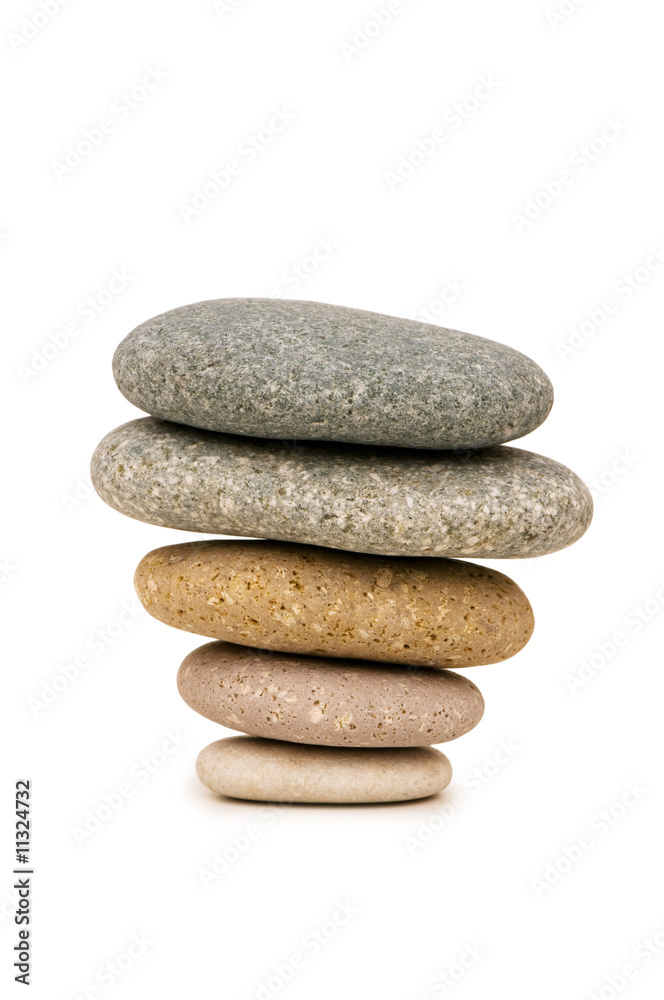Fototapeta premium Stack of pebbles isolated on the white background