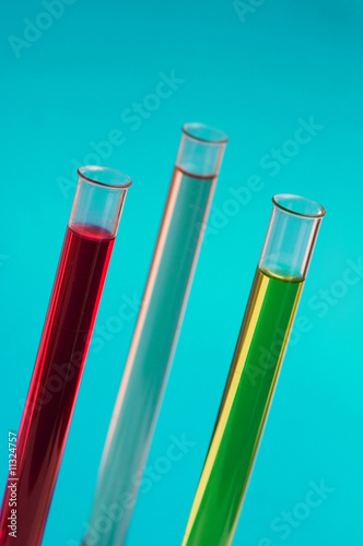 Three retorts in the lab against blue background