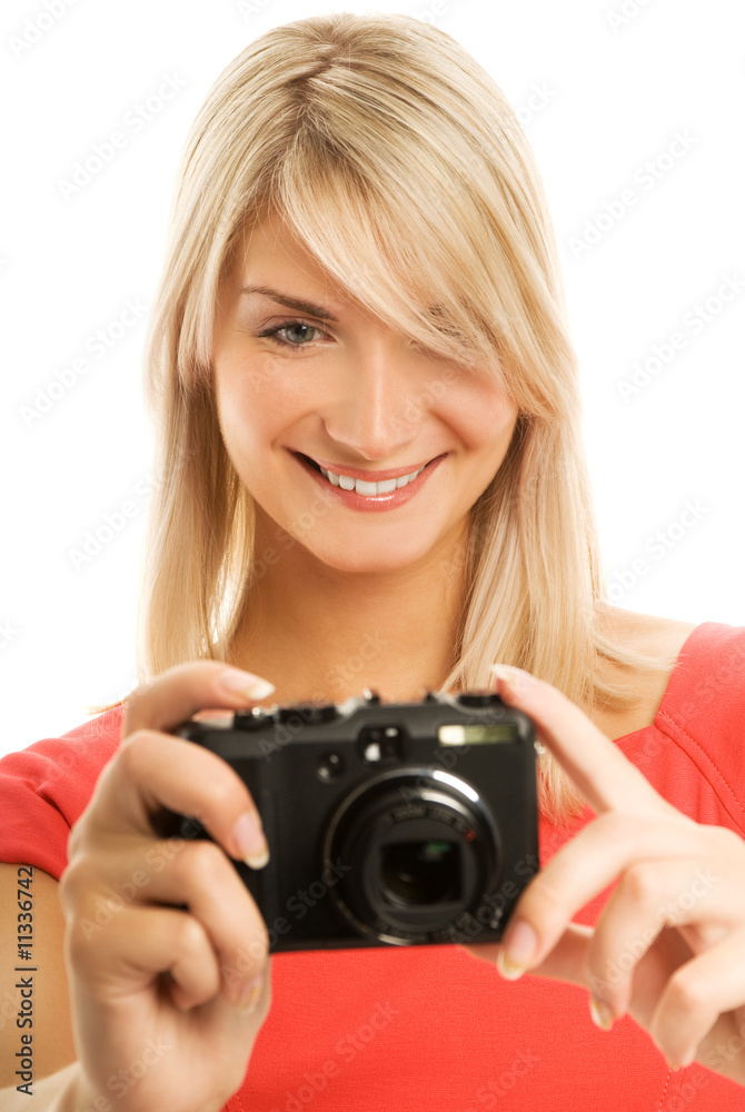Beautiful smiling woman with digital camera. Isolated on white b Beautiful smiling woman with digital camera. Isolated on white b