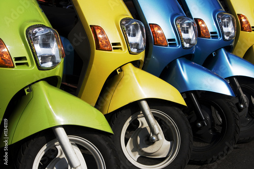 Canvas Print A line of scooters