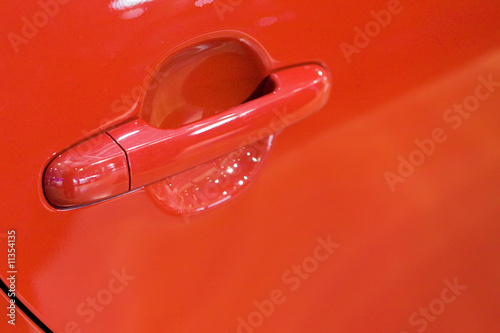 handle of bright red car