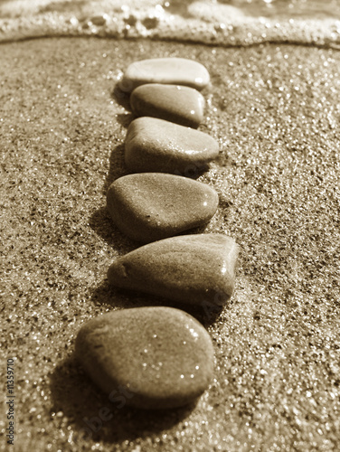 Stones on sand at the sea  a pebble