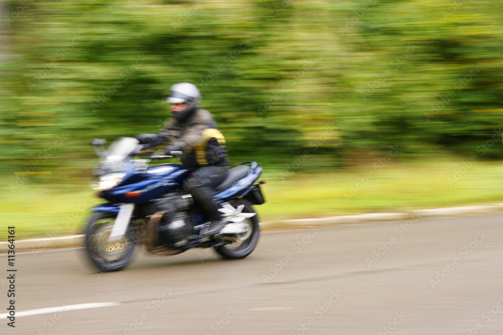 speed - danger - blurred motorcyclist