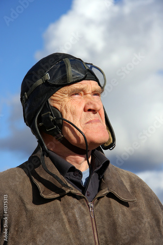 old pilot in old uniform looking upstairs to the sky © Brocorwin