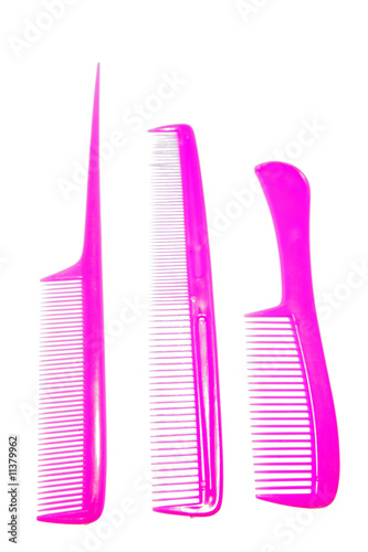 Three plastic combs on white background