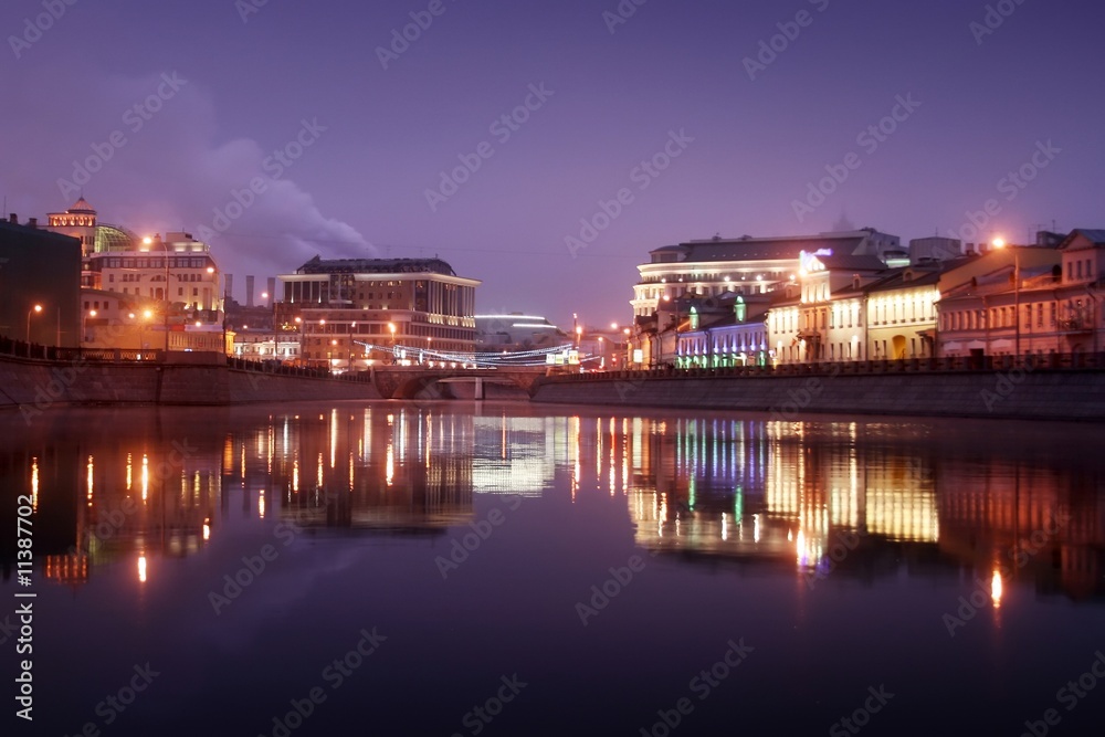 City reflection in the river at night