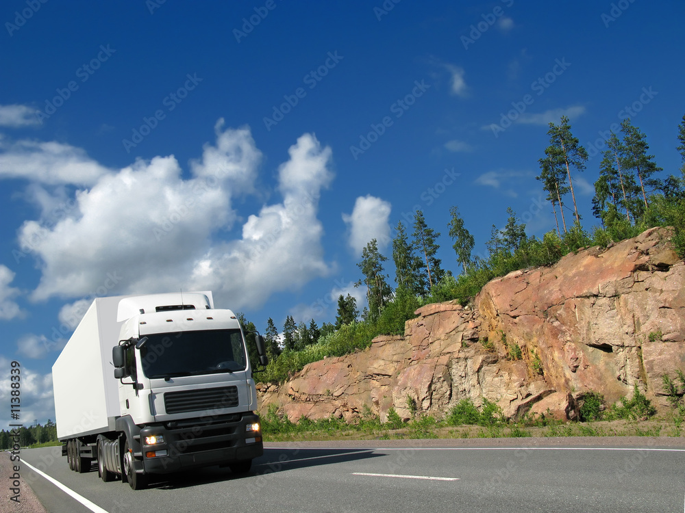white truck on rocky highway
