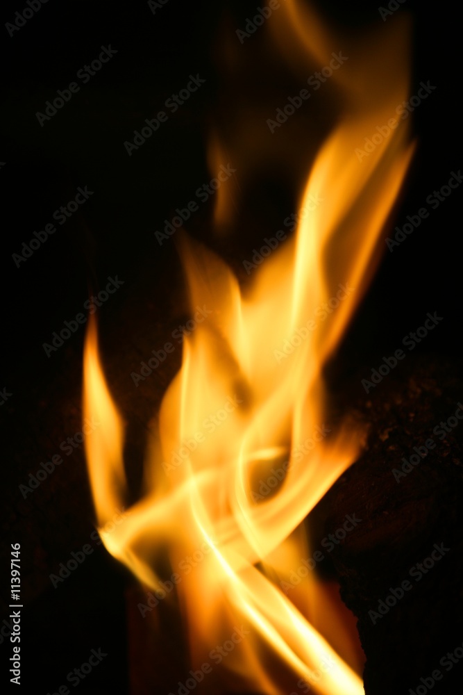 Orange fire over black background Orange fire over black background