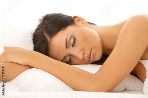 Portrait of 20-25 years old beautiful woman on white bed