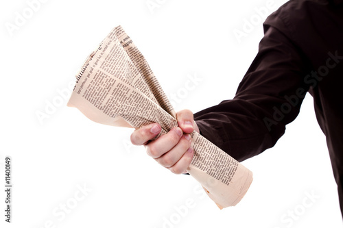 hand holding a newspaper