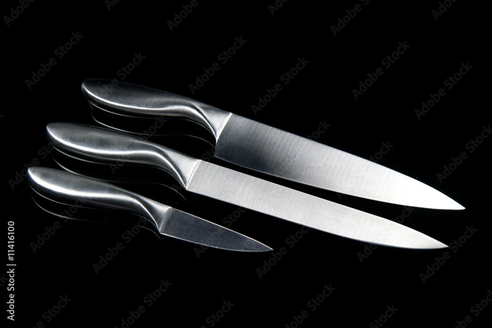 Obraz premium 3 kitchen knives on a black background
