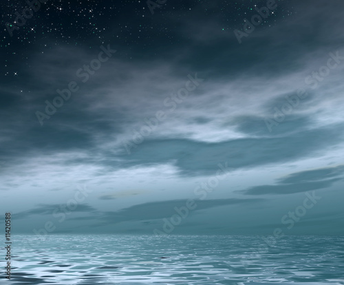 Evening cloudy sky with stars above sea