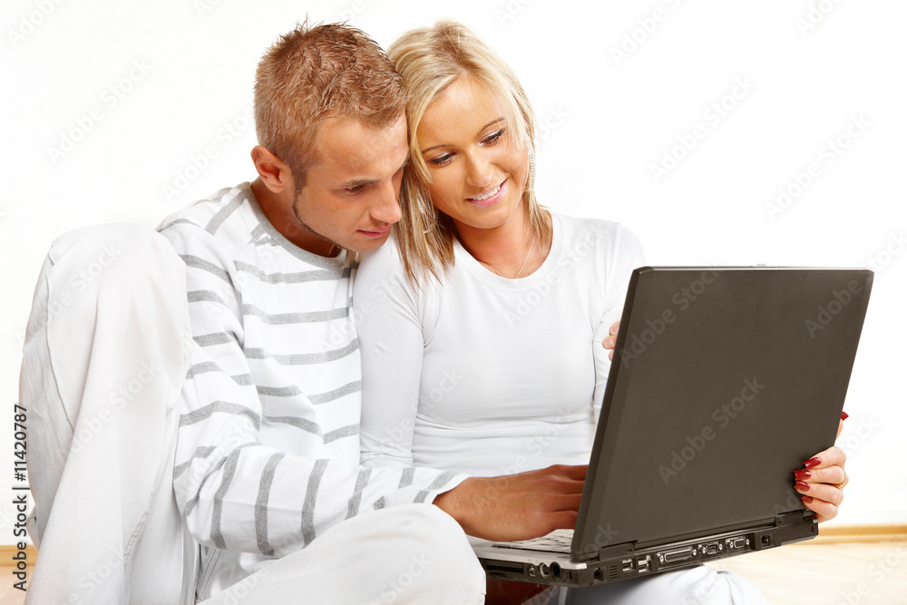 Happy couple with laptop