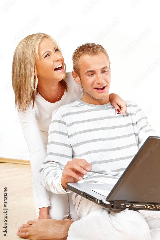 Happy couple with laptop Happy couple with laptop
