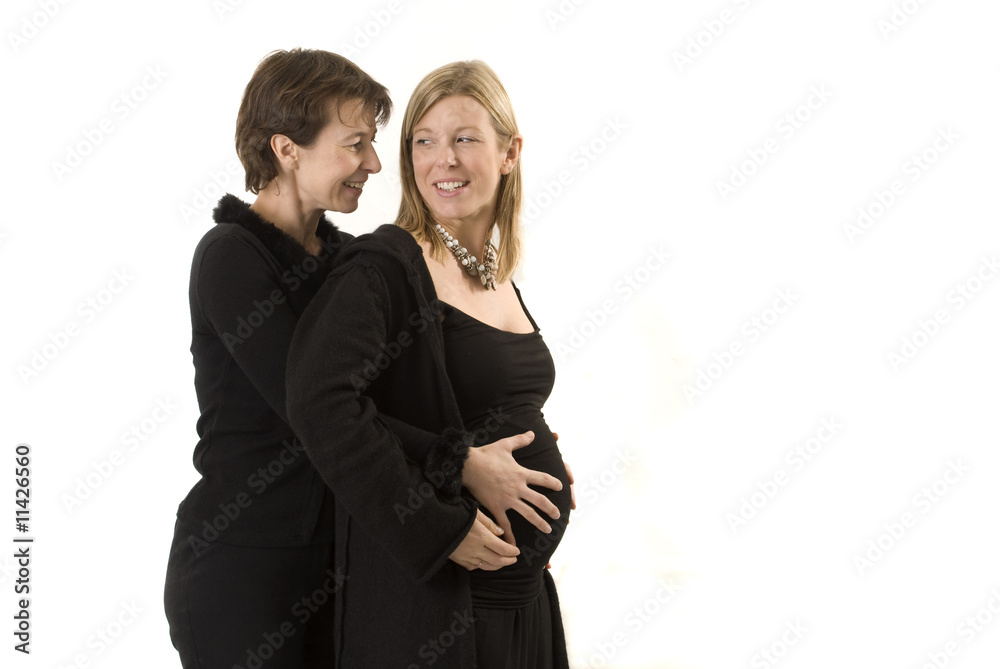 couple de jeunes femmes avec les mains sur le ventre couple de jeunes femmes avec les mains sur le ventre