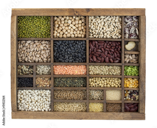 variety of beans, grains and seeds in vintage typesetter box