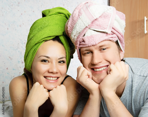 happy couple with towels on their heads