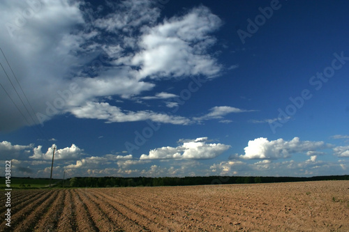 ploughed field and clouds