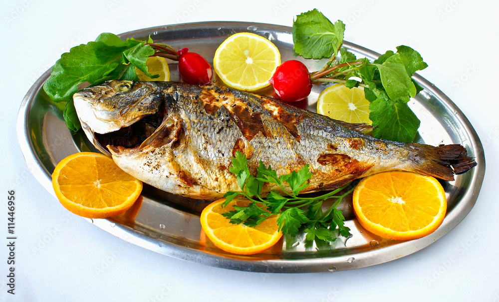 Cooked fish with lemons
