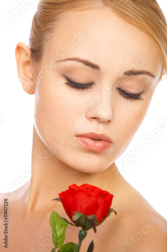 Portrait of cute blond woman  holding red rose