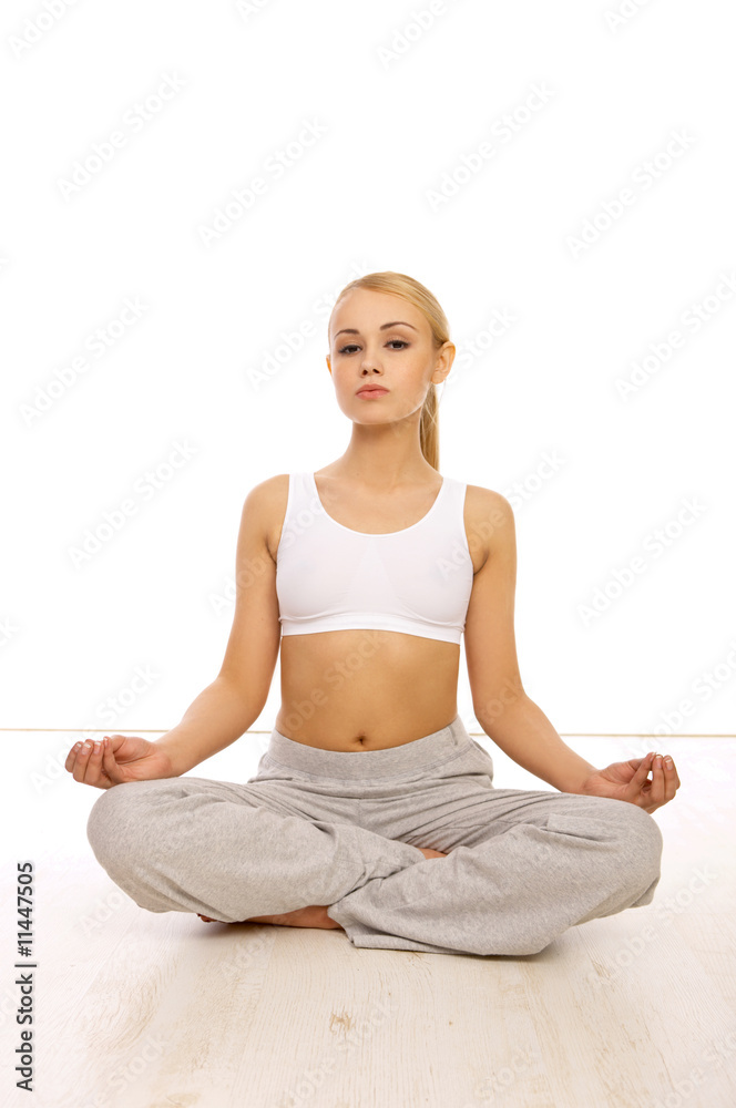 Portfait of Sporty beautiful girl sitting in yoga position Portfait of Sporty beautiful girl sitting in yoga position
