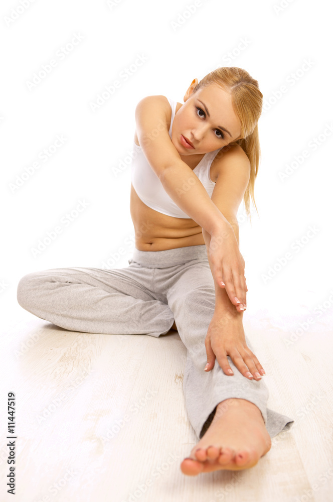 Portfait of Sporty beautiful girl stretching on white Portfait of Sporty beautiful girl stretching on white