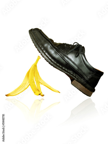 banana peel under the black shoe