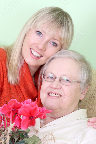 Photo of old lady with young woman photo