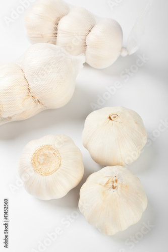 a group of garlic heads close up