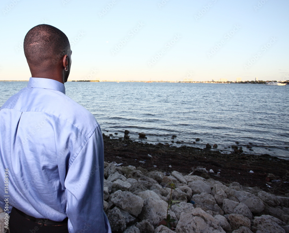 Businessman looking over the horizon