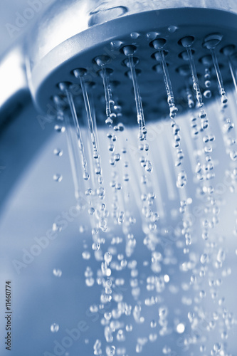 water flowing from metal shower