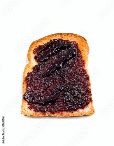 crispy white bread toast with berry jam spread isolated