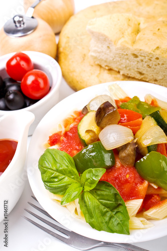 penne pasta with vegetables, basil, olives and foccacia bread