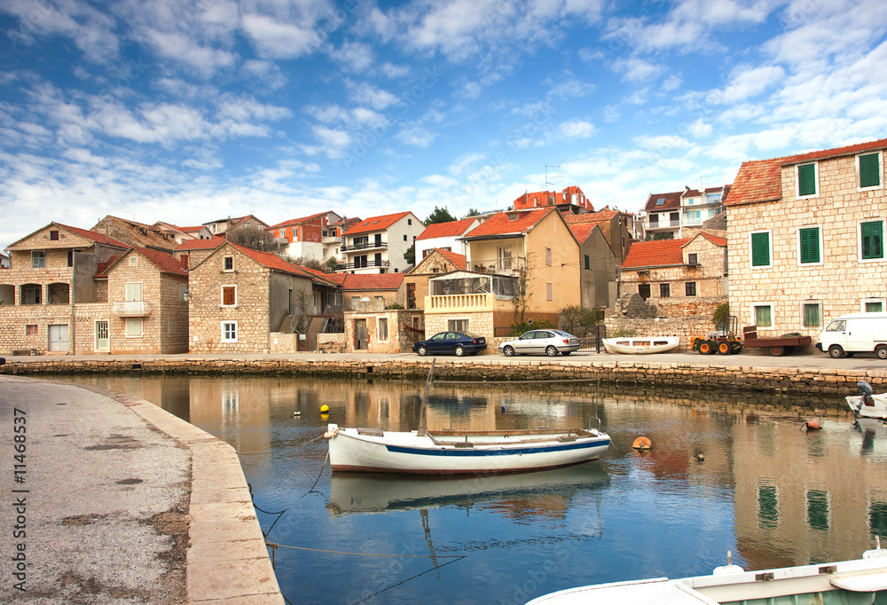 Obraz premium mediterranean town parted with channel (Croatia, Hvar)